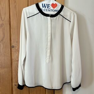 White gauzy blouse with black trim